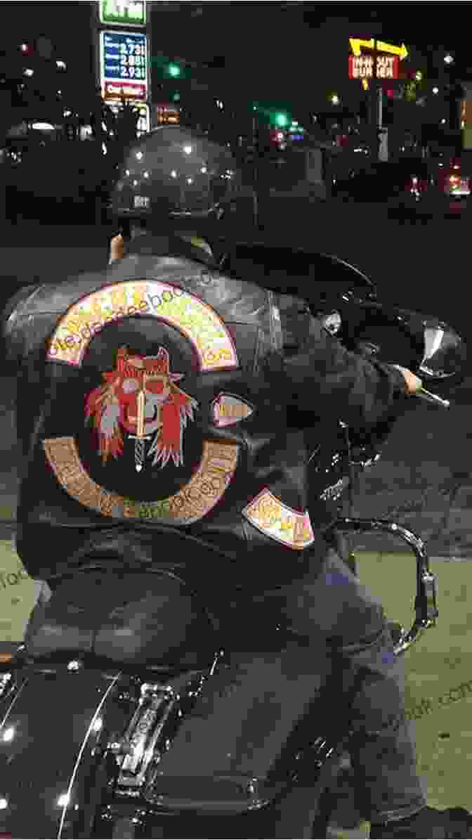 A Group Of Tattz Royal Devils Motorcycle Club Members Gathered Around A Bonfire, Their Faces Etched With Pride And A Sense Of Belonging. Tattz: Royal Devils MC Central Coast