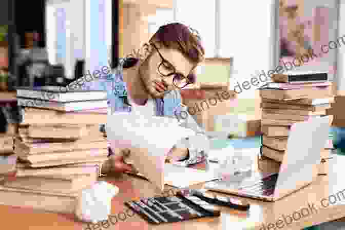 A Photo Of Theo Working Diligently At His Desk, Surrounded By Books And Papers. THEO JAMES Divergent S FOUR: 101 Facts With Theo S Own Words
