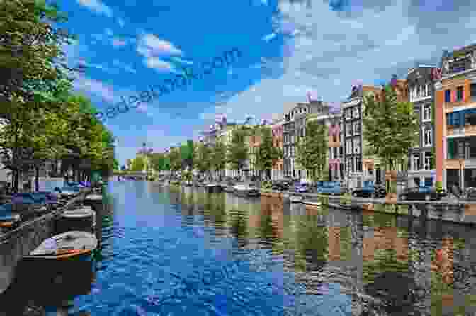The Canals Of Amsterdam Are A Beautiful Sight To Behold. This Photo Shows A Canal Lined With Colorful Houses And Boats. Amsterdam Travel Guide With 100 Landscape Photos