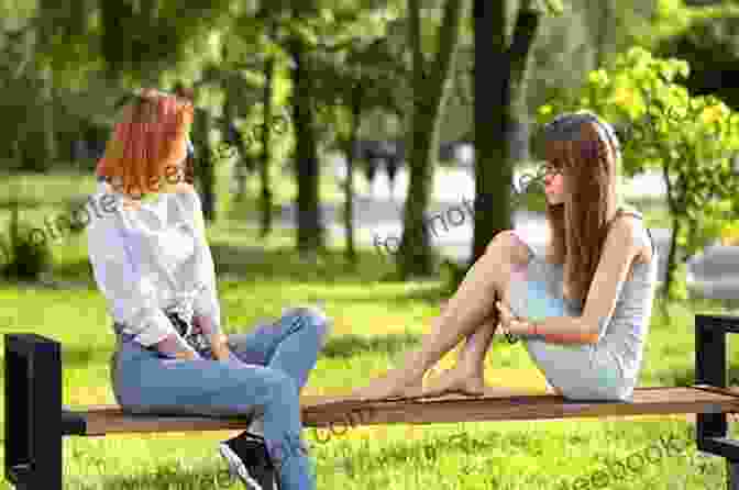 Two Young Girls Sitting On A Bench, Smiling And Holding Hands Two Little Women On A Holiday