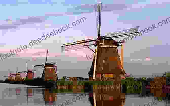Windmills Standing Tall Against A Backdrop Of Blue Skies And Green Meadows, Symbolizing The Netherlands' Rich Cultural Heritage And Technological Advancements. Photo Essay: Beauty Of The Netherlands: Volume 62 (Travel Photo Essays)